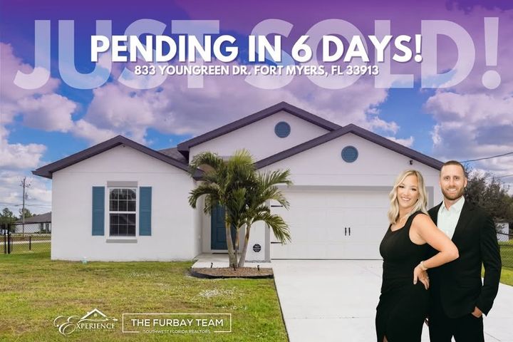 Kristen and Wesley in front of a home that went pending in six days