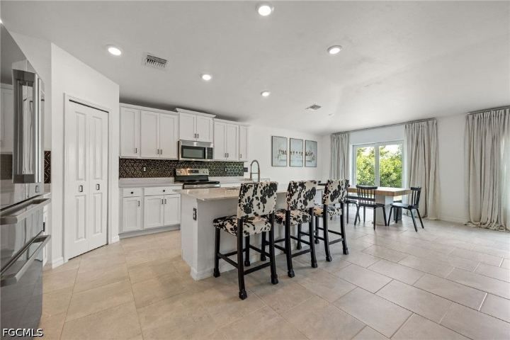Kitchen and living area at 13910 Buckingham Oak Drive
